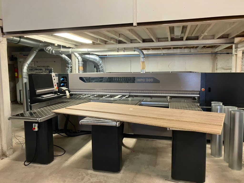 Beam saw cutting a panel to size